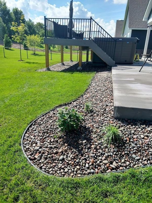 Landscape rock and edging under deck