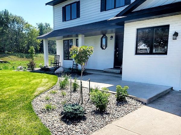 Minnesota front foundation landscape re-do with ornamental trees, shrubs, and ornamental grasses