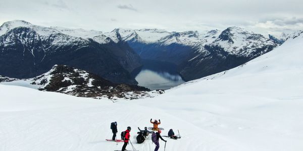 Group skiing in snowy mountains.