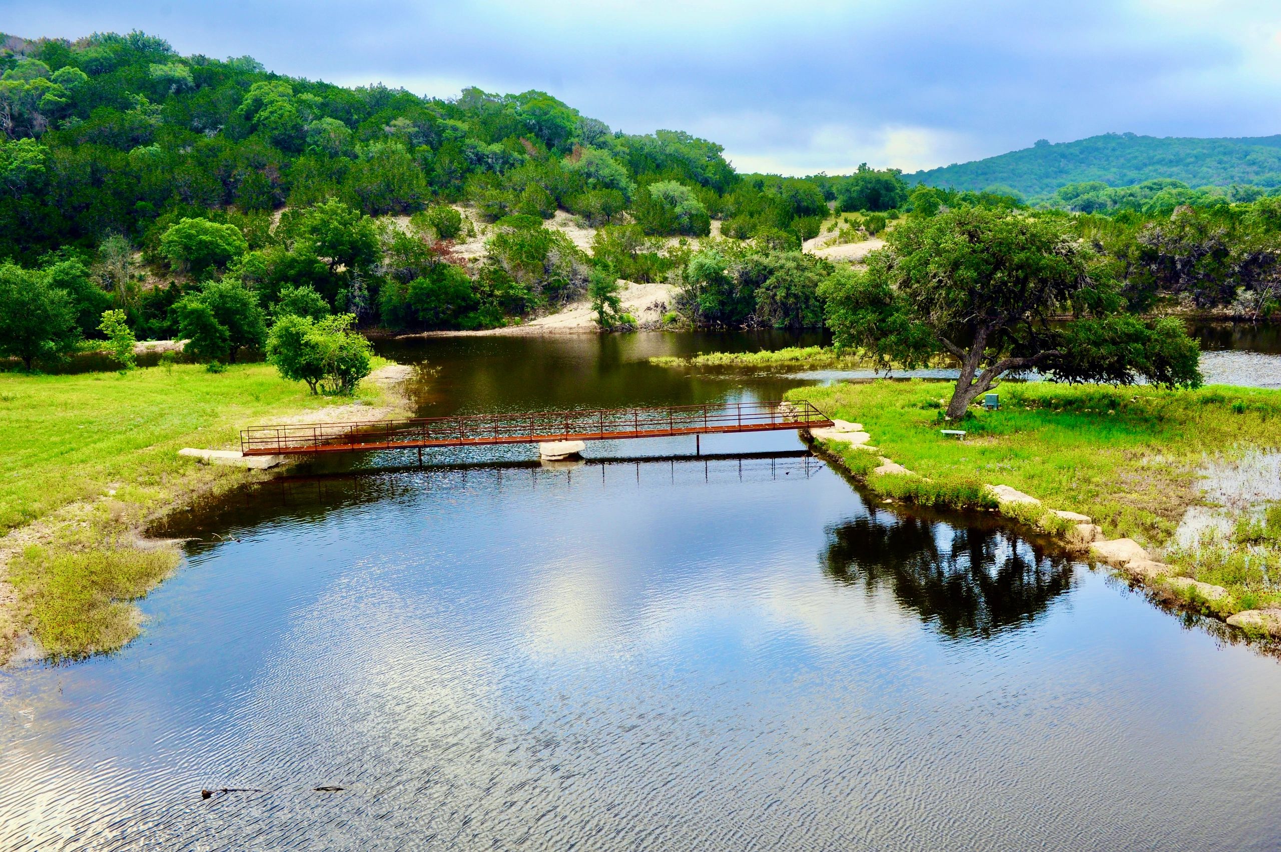 Bridge built by 3R Sodbusters connecting both sides of the large lake also created by 3R Sodbusters.