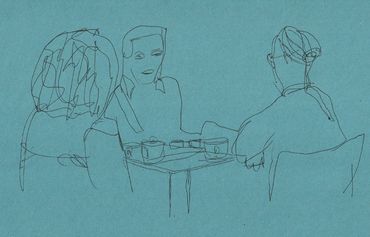 People chatting around a table.
