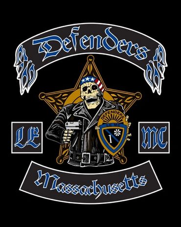 Skeleton biker with gun and shield in a Defenders MC Massachusetts emblem.