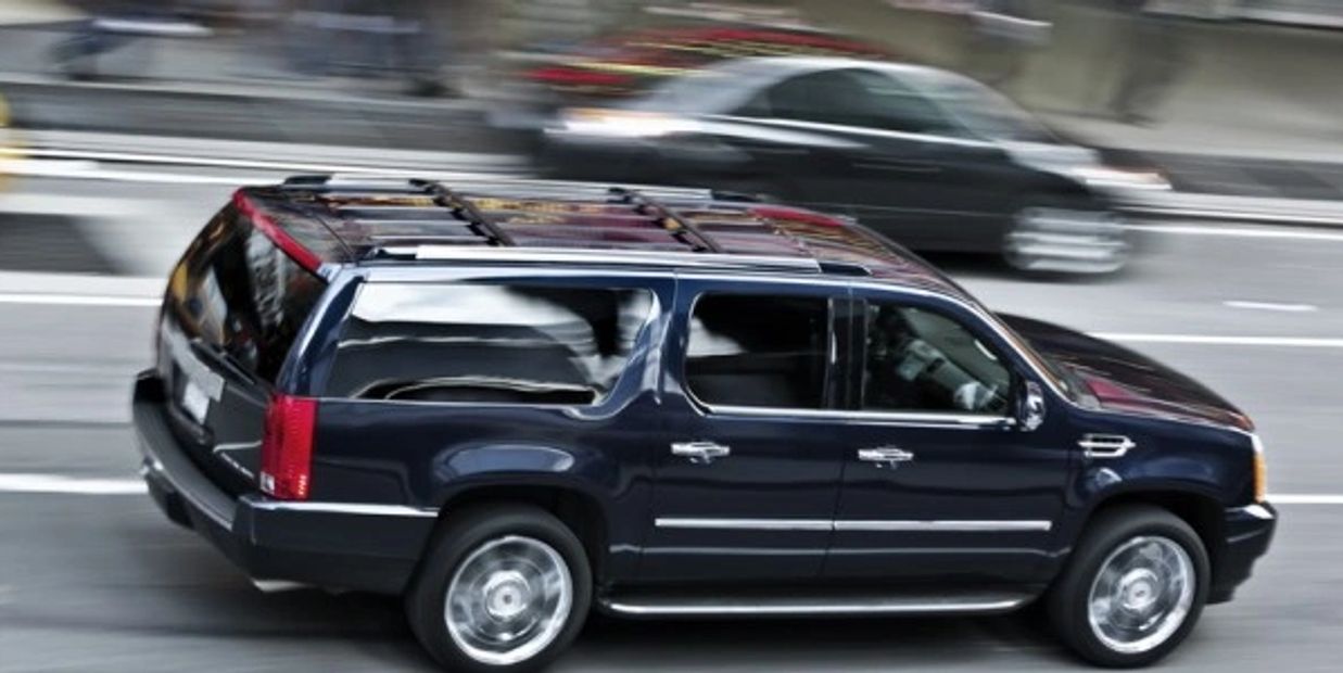 Black Escalade on Main St.