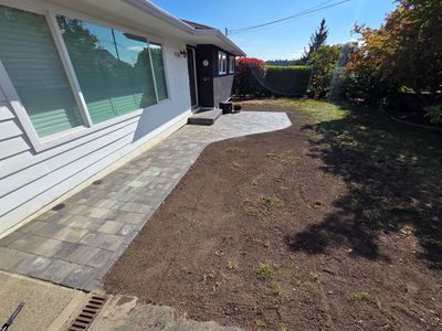 Interlocking paver walkway installation in Nanaimo with proper base preparation and drainage.