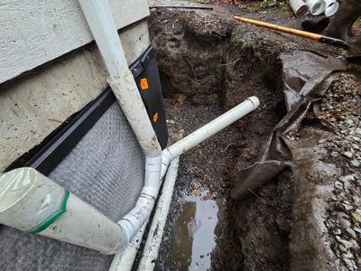 Foundation drainage repair with new drain tile and waterproofing membrane in Nanaimo.