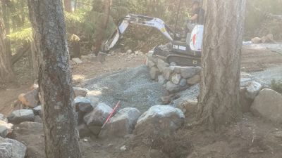 Excavator completing site preparation and grading for a landscape construction project @ Nanaimo, BC