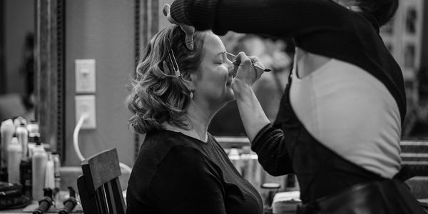 Deborah and Elizabeth applying a moisturizer in prep to prime her guest skin before a makeup service