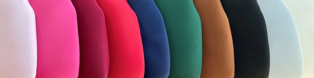 coloured cushions arranged in a display pattern