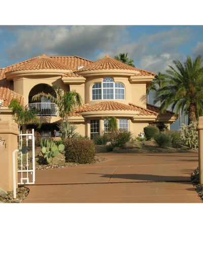 Photo by James Day on Unsplash, showing beautiful home in Arizona under a cloudy and blue sky, real estate team helped buyers