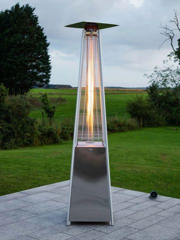 tall outdoor gas heater on a patio with flame on
