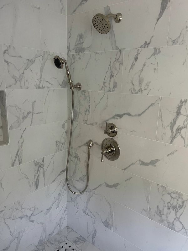 Brizo thermostatic shower trim with diverter serving main shower head and handheld shower head