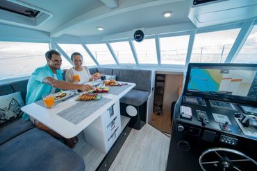 Honeymoon couple enjoy a meal onboard SeaWolf