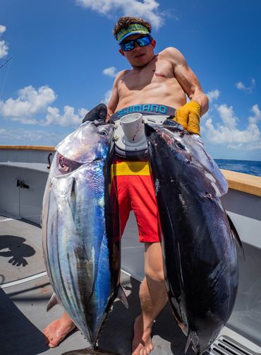 Happy fisherman onboard SeaWolf with his two tuna