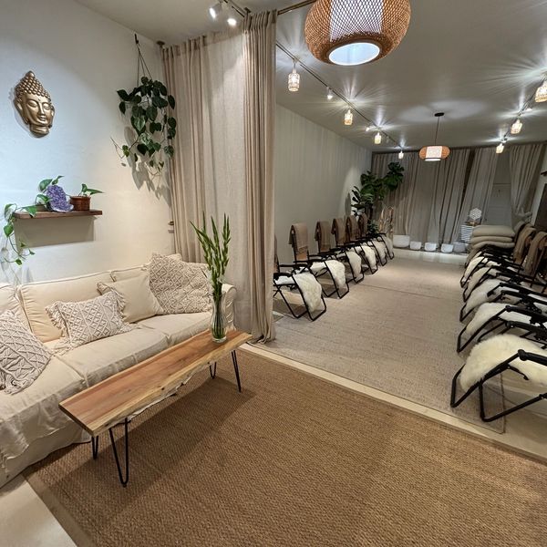 Peaceful meditation room with comfortable seating and soft lighting.