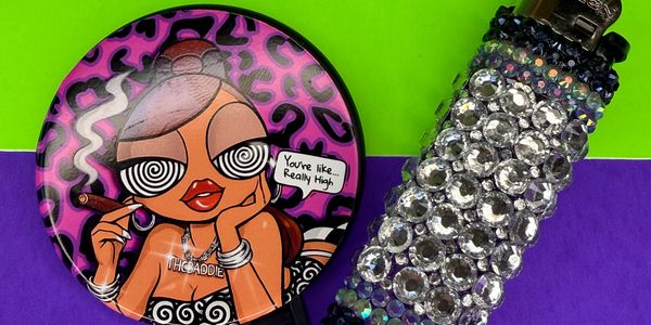 Colorful psychedelic pin and rhinestone lighter.