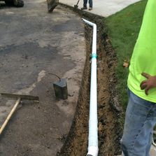 Someone demonstrating drainage repair in Loveland, OH