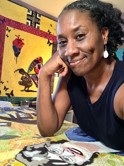 Quilt artist, Kena Tangi Dorsey in her quilting studio
