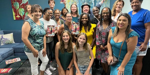 Group of women gathered together at the Empowered Women In Wellness Courage to Shine Book Signing.