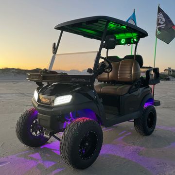 A Custom Black 2022 Club Car Tempo with a 6in lift kit, under glow and a sound bar