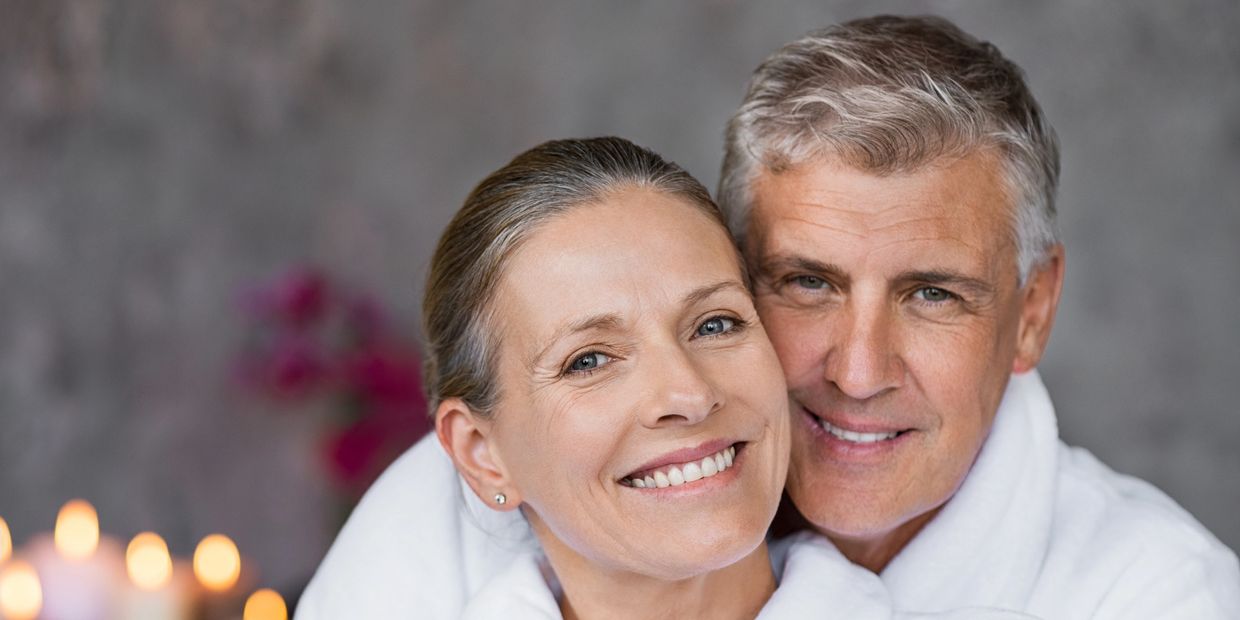 Smiling mature couple enjoying a cozy moment together.