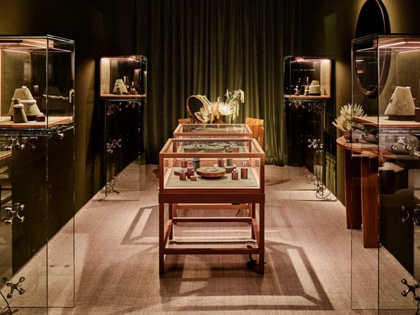 Luxurious jewelry display in a warmly lit, elegant showroom.