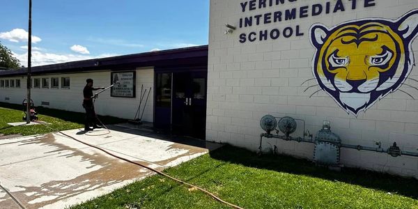 commercial school building being pressure washed.