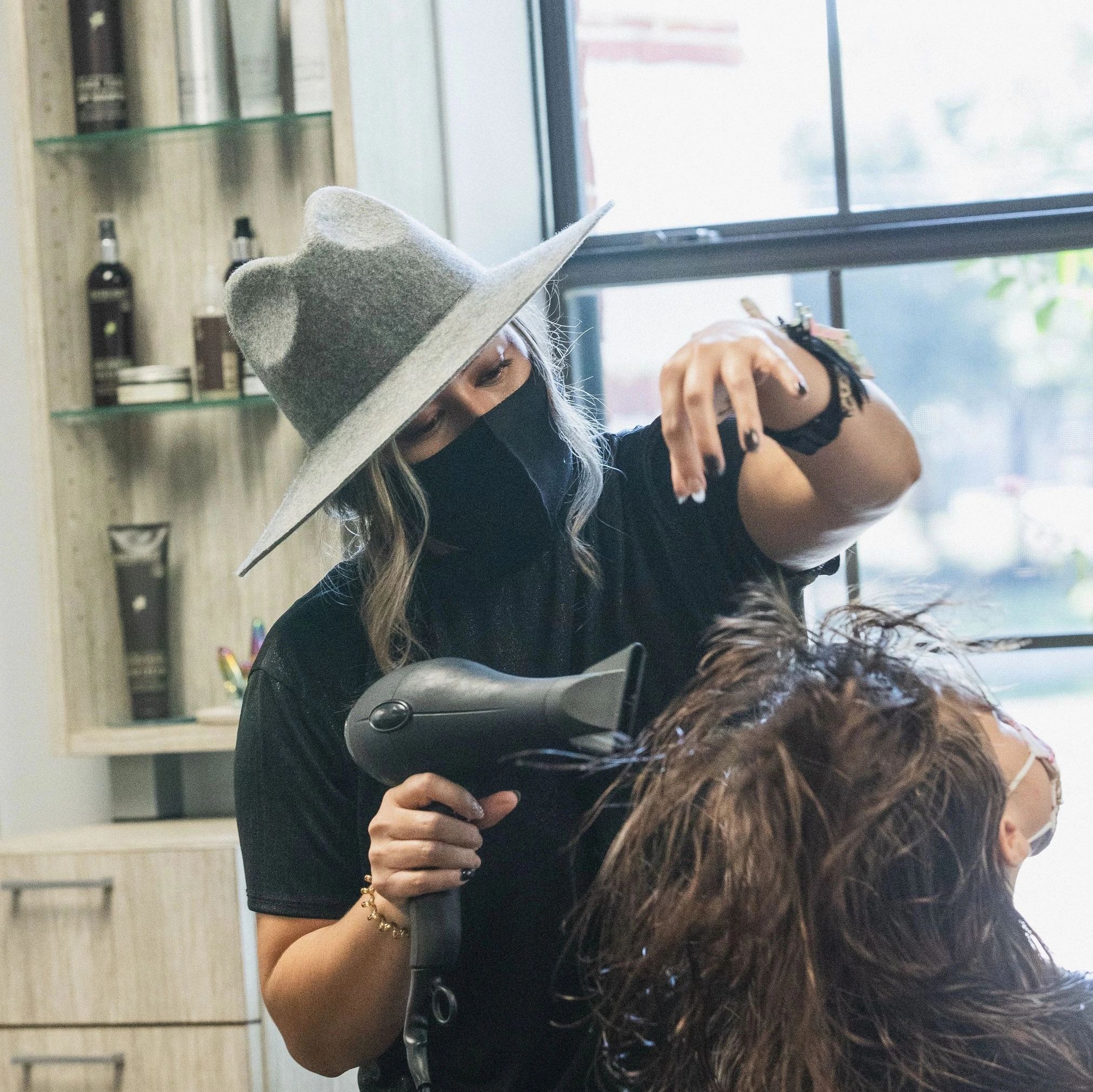 Head Case Hair Studio. The stylist giving a blowout.