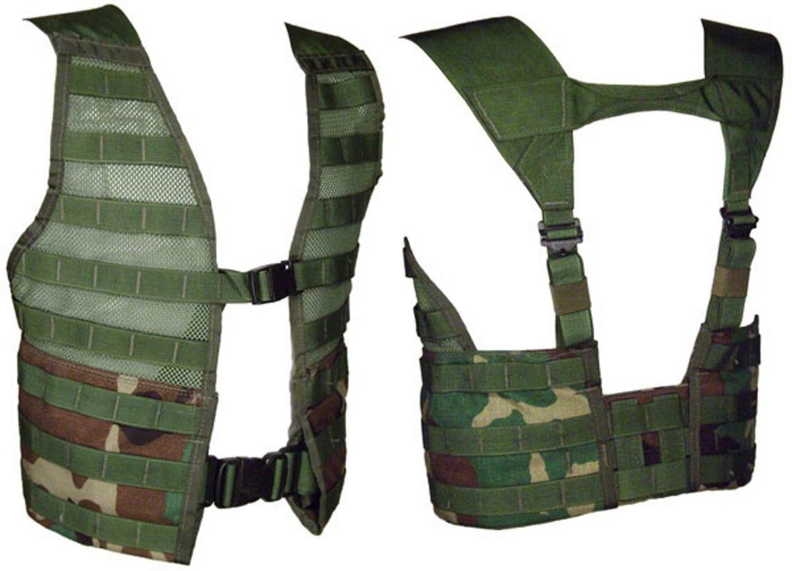Used U.S. military issue woodland M.O.L.L.E. II fighting load carrier.