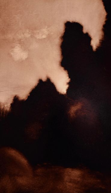 Abstract art with dark and light brown shades creating a smoky effect.