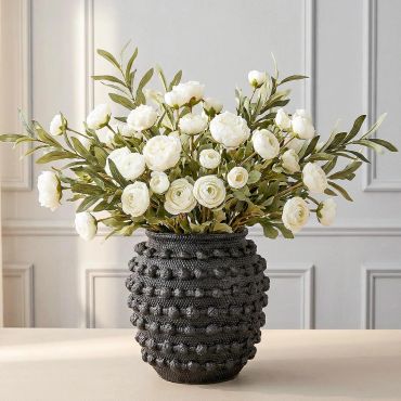 This textured vase is perfect for adding a rustic touch to your home decor. Love the look!