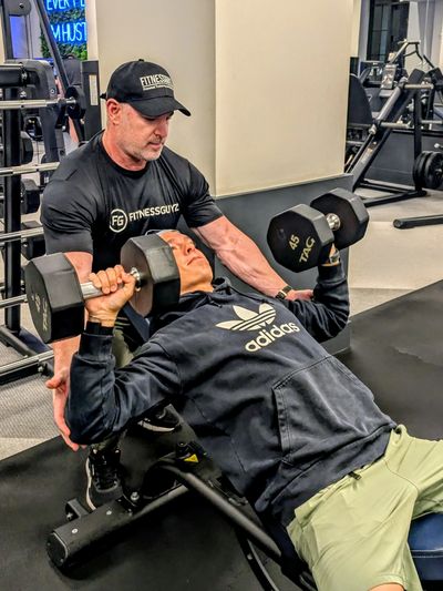 Personal trainer Mark Katz training client in Weston apartment gym