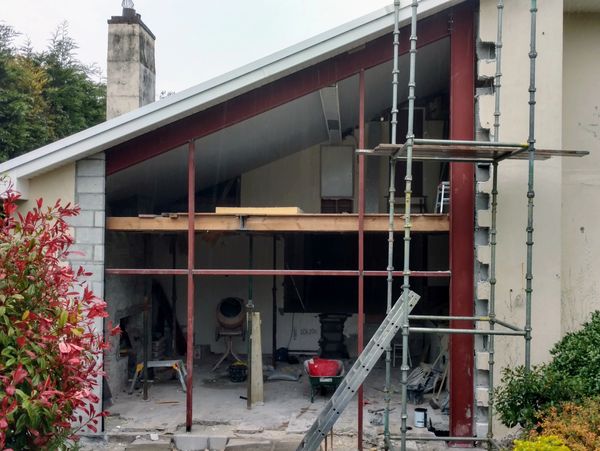 Exterior renovation of the modern residential house, scaffolding tower