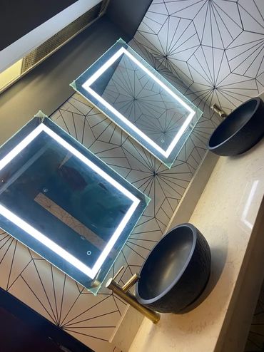 Angled view of glowing mirrors.
