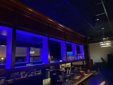 Bar interior with blue lighting.

