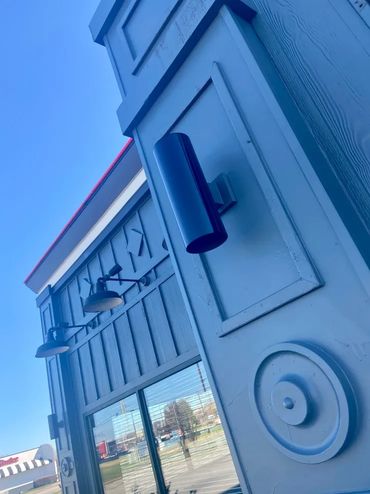Blue exterior of commercial building.