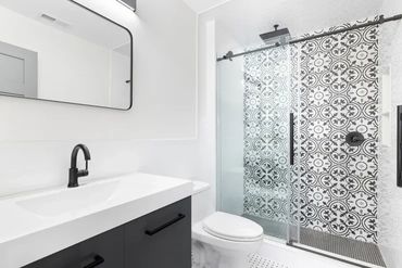 Modern bathroom with glass shower.

