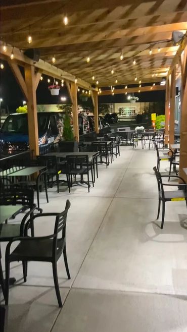 Empty outdoor restaurant patio seating.