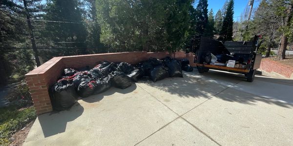 Bagged construction debris staged for fast, professional haul-away by Big Guy Junk Removal.