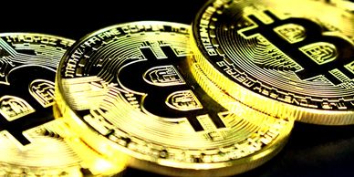 Bitcoin Novelty coins on laptop