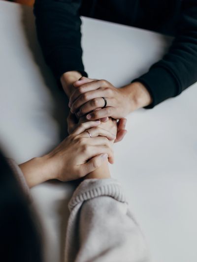 Two people hold hands. Photo by: Priscilla Du Preez.