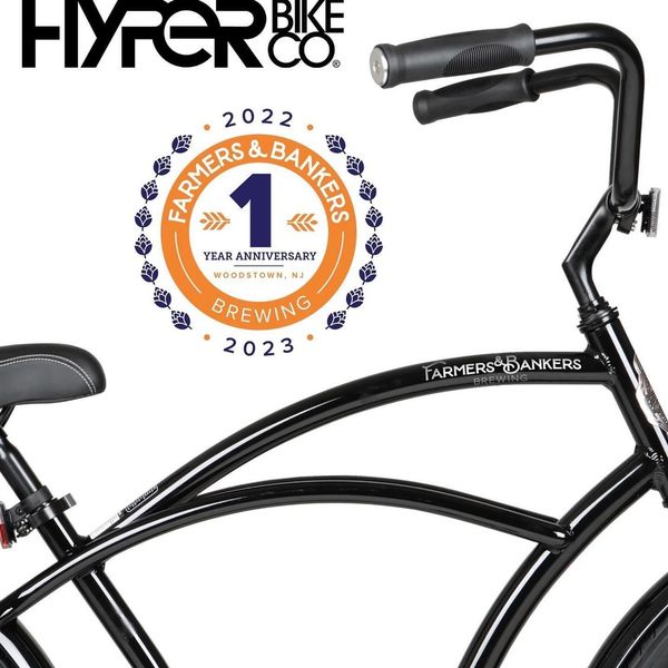 Close-up image of a beach cruiser bicycle with Farmers & Bankers Brewery logos.