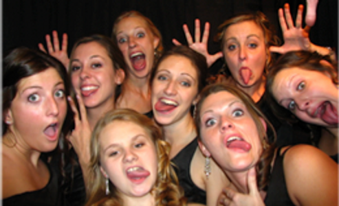 guests using the little black booth photo booth during wedding rental in Grand Rapids