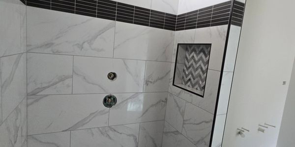 Custom porcelain shower with recessed shampoo niche