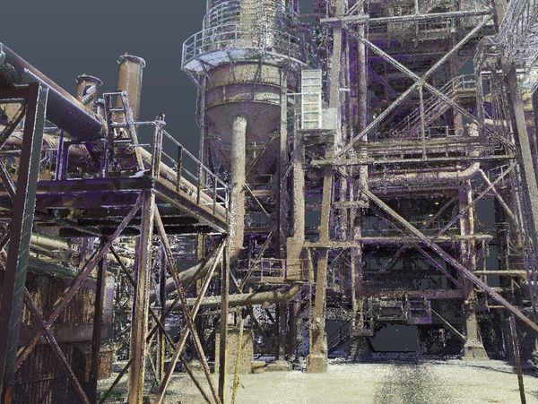 Industrial structure with metal framework and pipes.