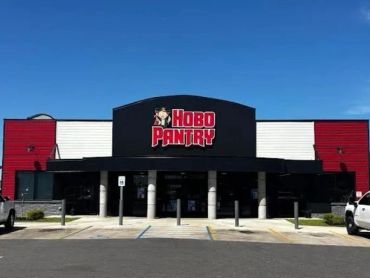 Exterior of Hobo Pantry restaurant under a clear blue sky.