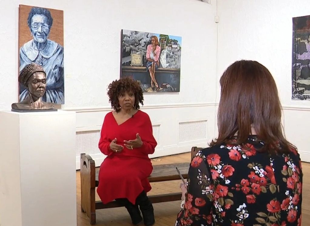 Being interviewed by Amy Lange of  Fox 2 Detroit.  Two of my artworks  are to the left.