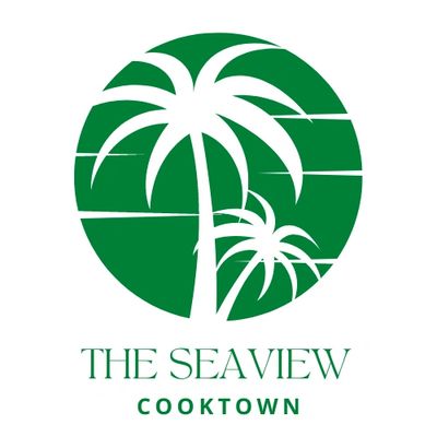 Logo with two green palm trees inside a circle, labeled 'The Seaview Cooktown'.