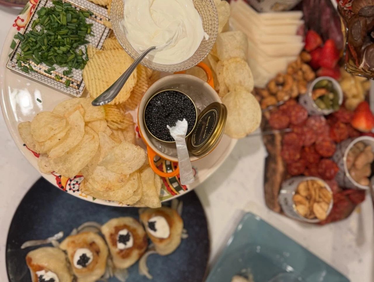Caviar served with chips and crème fraîche for a dinner party serving guide
