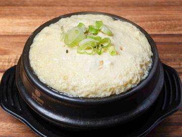 Korean egg custard in a black bowl