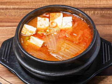 Spicy traditional kimchi soup in a bowl
